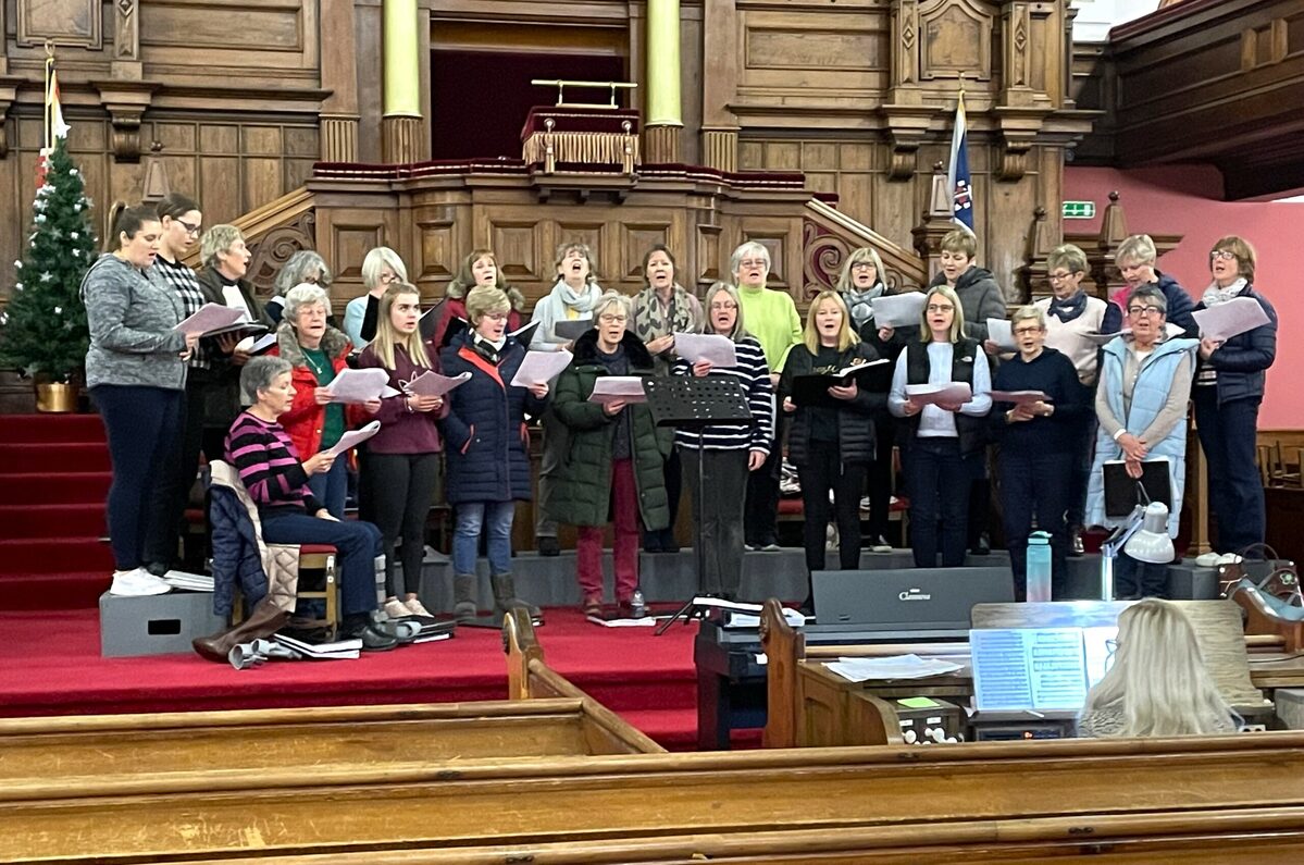 Chorale singers warm up for charity Christmas concert