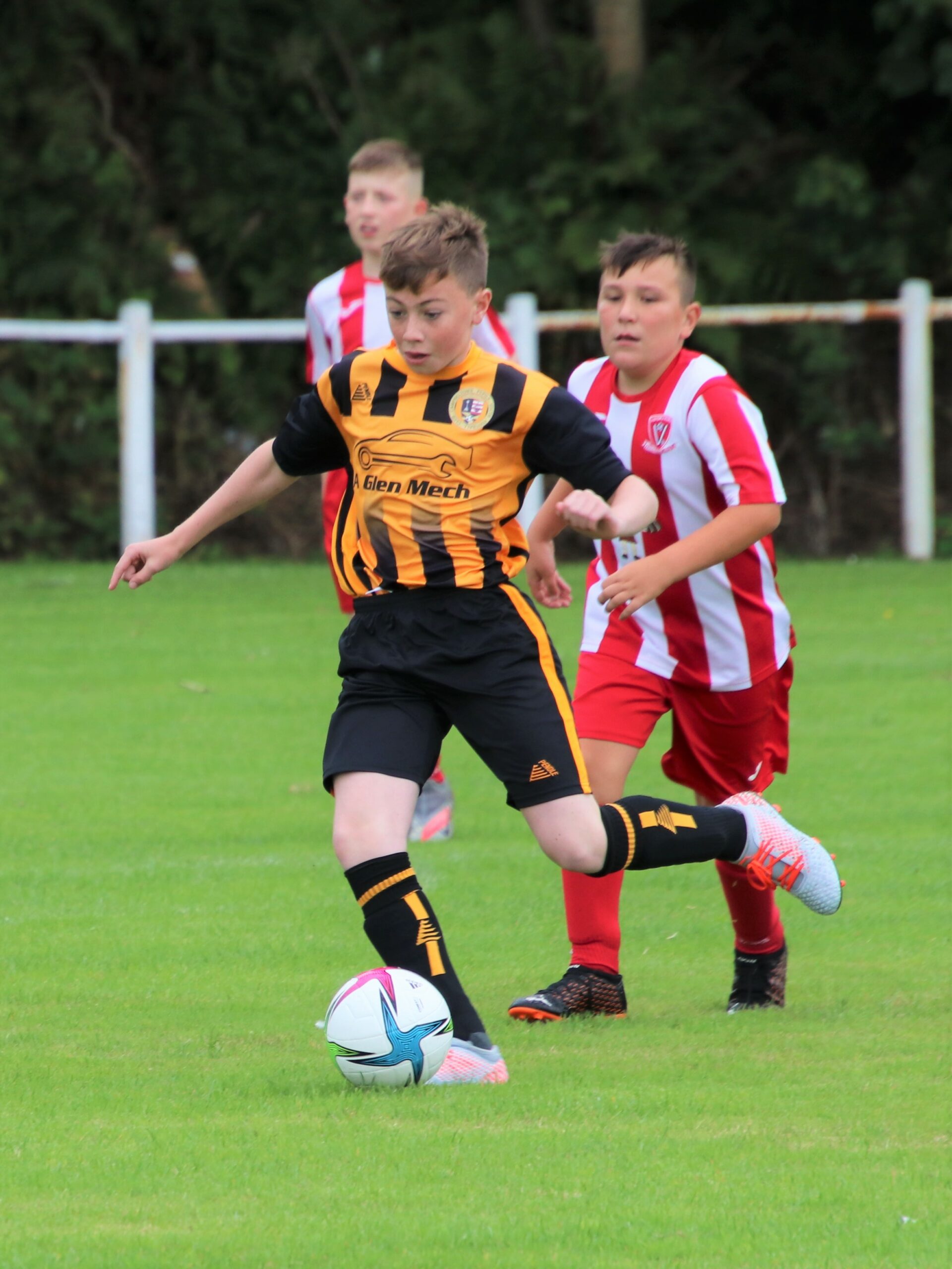 Pupils U13s in football action