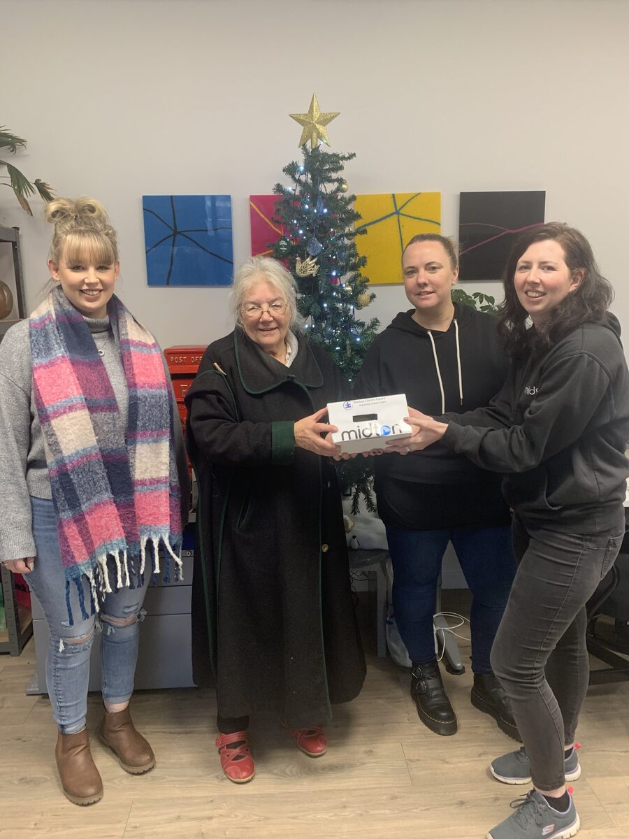 Midton hands cheque to Dochas