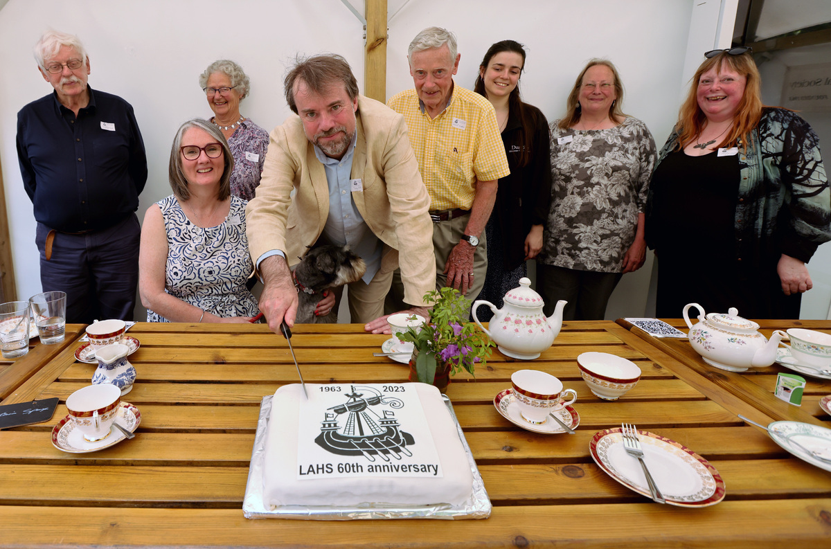 Professor Tony Pollard, patron of Lorn Archaeological and Historical Society, cutting its 60th anniversary cake.