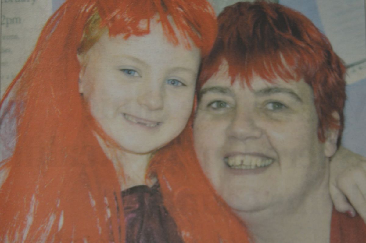 2014: Little Sophie Macivor found the perfect hair piece at the table top sale in Lochgilphead on Sunday, earning the same red locks as mum Helen Rhodick. The pair were amongst a wealth of people to sell handmade goods, bric-a-brac and books at the town’s