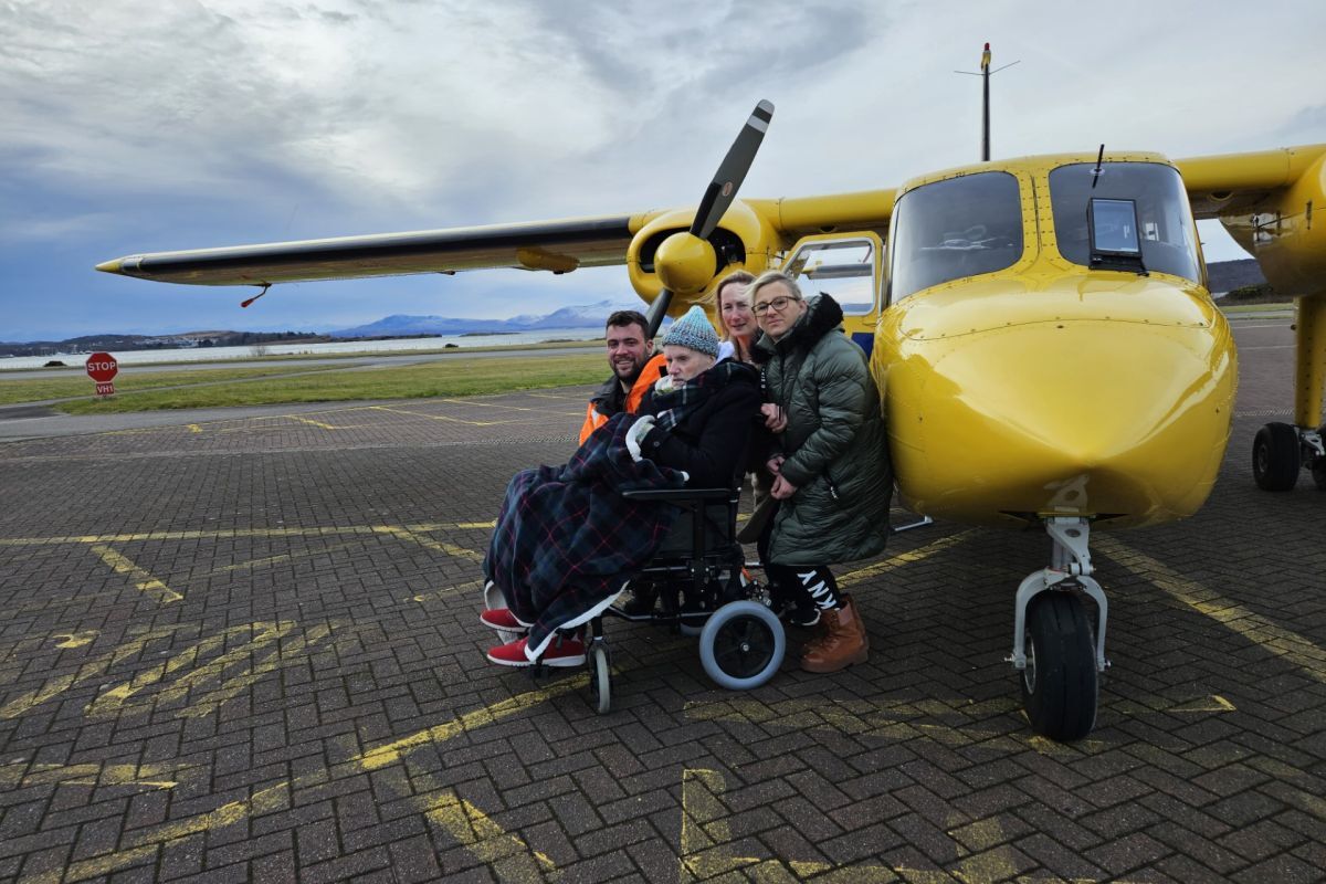 Herbert with staff from Eader Glinn Residential Home and Oban Airport. Photograph: Argyll and Bute Health and Social Care Partnership