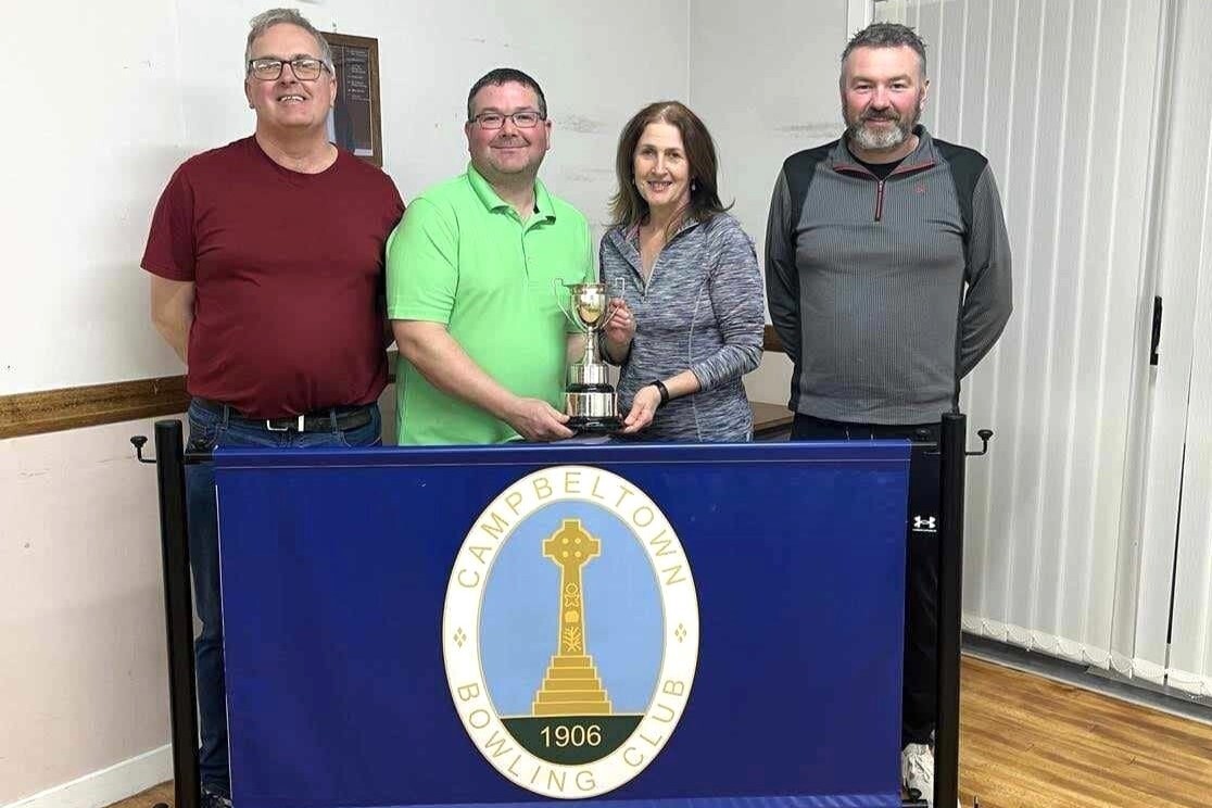 Tennent’s pairs winners Robert Coffield and Mary McKinnon, centre, with runners-up James McPhee, left, and Bobby Dalziel, right.