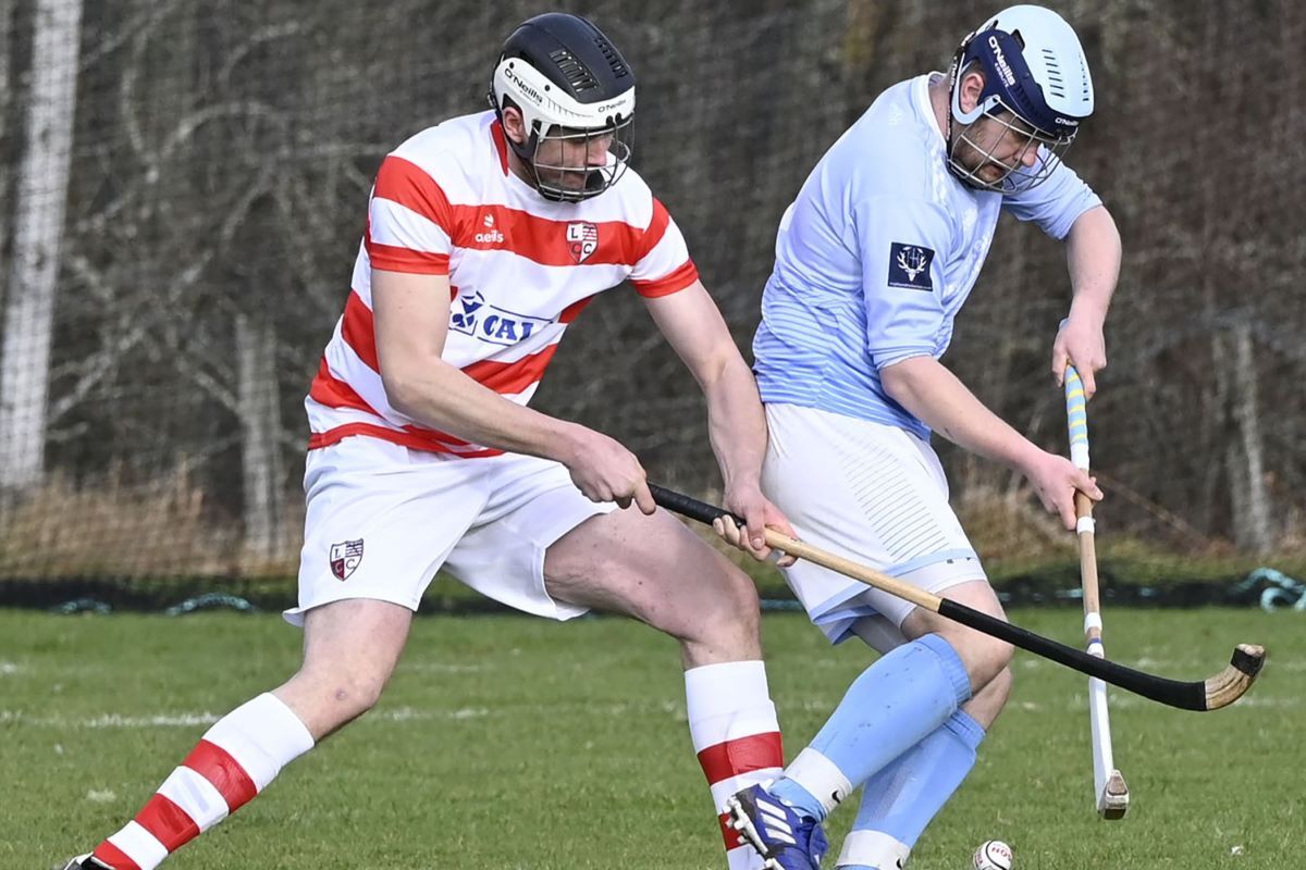 Lochaber's Callum MacDonald tackles Caberfeidh double scorer Liam Symonds. Photograph: Iain Ferguson, alba.photos.