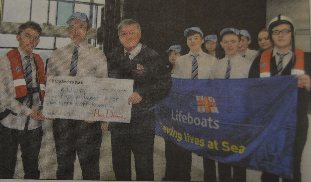 2014: Patrick Feeney, left, and Ryan McCraig presented George Bradley, lifeboat operations manager at Campbeltown with a cheque for £559.