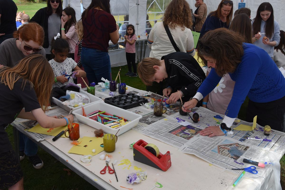 Children and parents add a splash of colour to their eggs in the egg decoration competition.