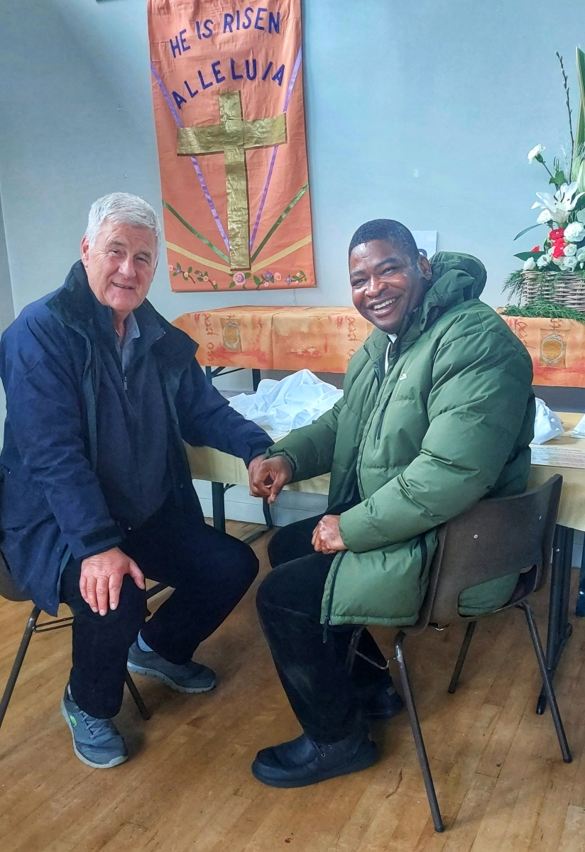 Father Philip and Arthur discuss the Journey to the Cross displays in Ardishaig Public Hall.
