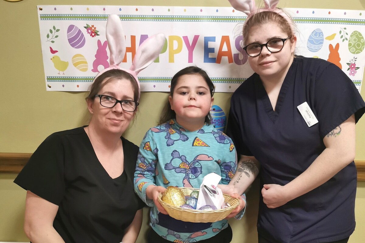 Health care assistant Frances McNeill with her daughters Kayleigh, right, a fellow health care assistant, and Naeve, centre, who enjoyed the Easter fun.