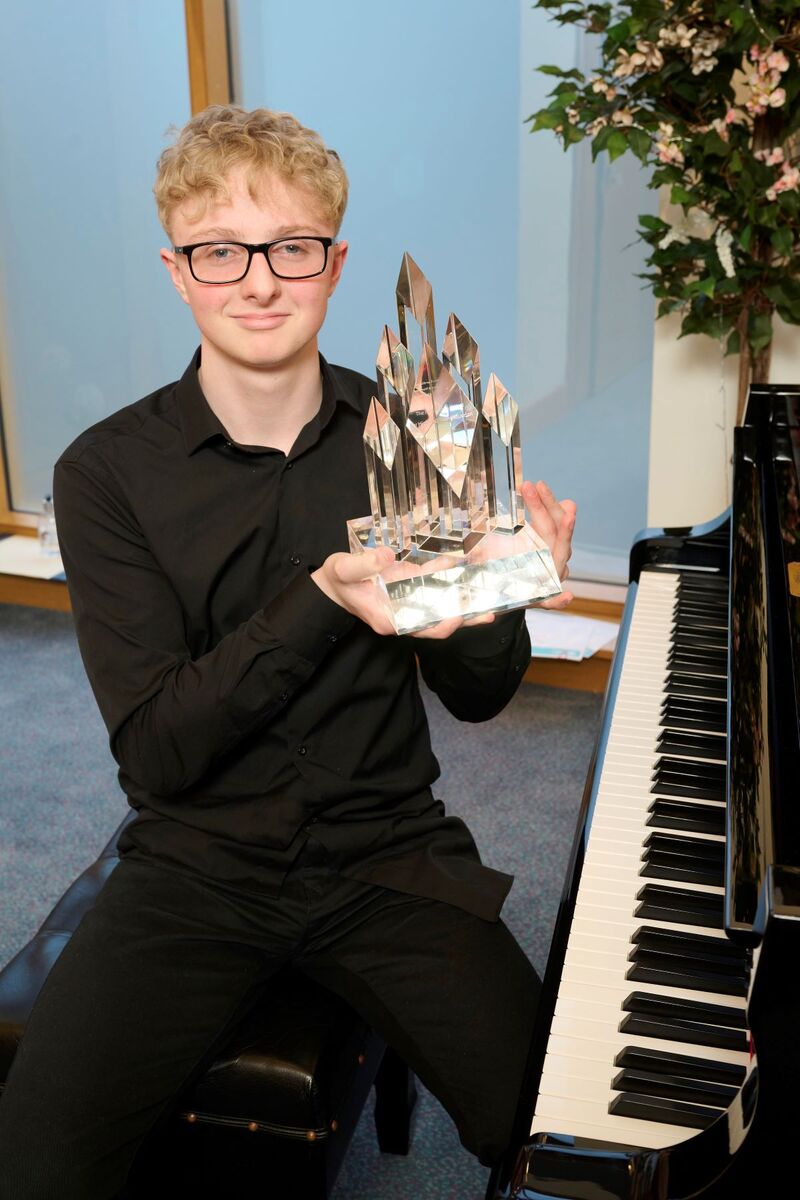 Ardnamurchan's Fin Young with his Highland Young Musician of the Year trophy.