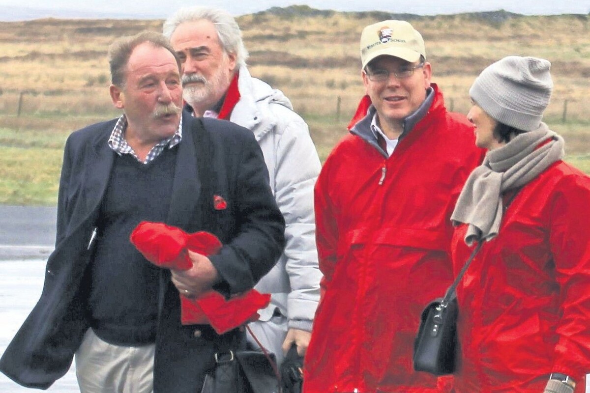 2014: Whisky writer Charles MacLean, left, welcomes HSH Prince Albert of Monaco, second from right, and his party at Islay Airport.