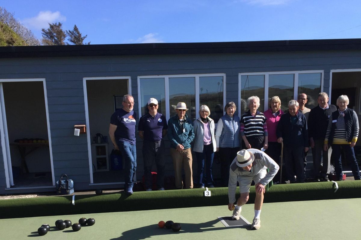 Blackwaterfoot Bowling Club chairman Brian Sherwood launches the first jack to start the bowling season. Photograph: BWFBC.