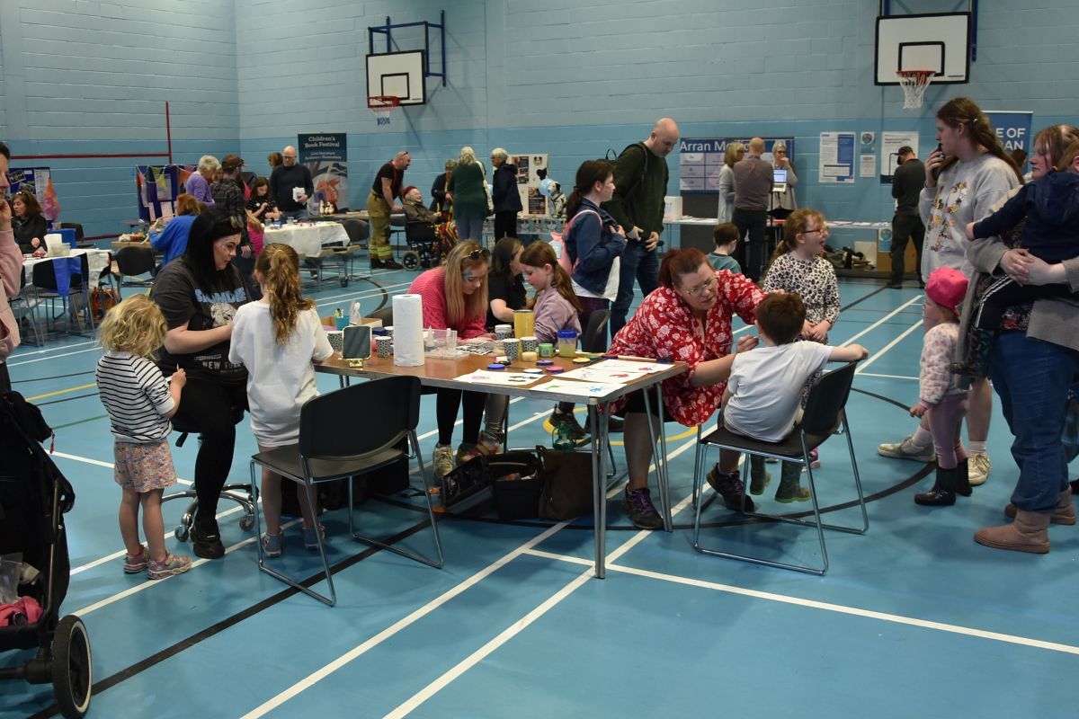Children have their faces painted at the very popular face-painting stall.