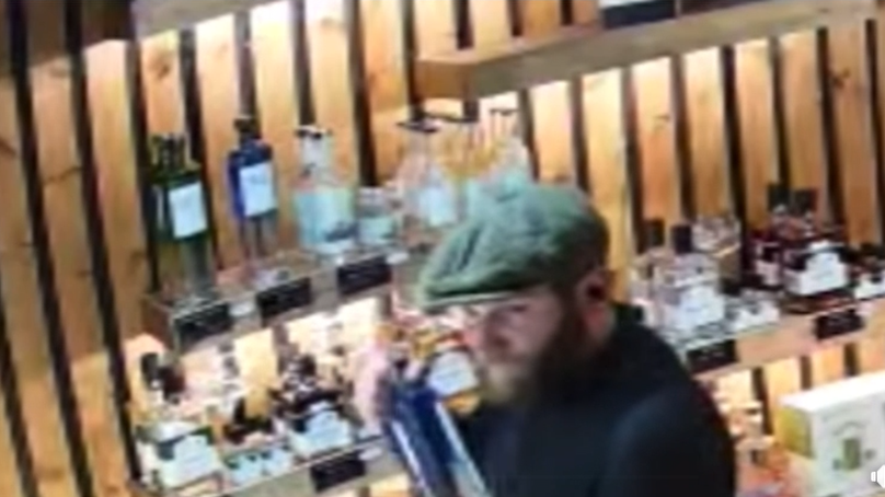 Video: Brazen gin and whisky thief stuffs stolen drink down his trousers