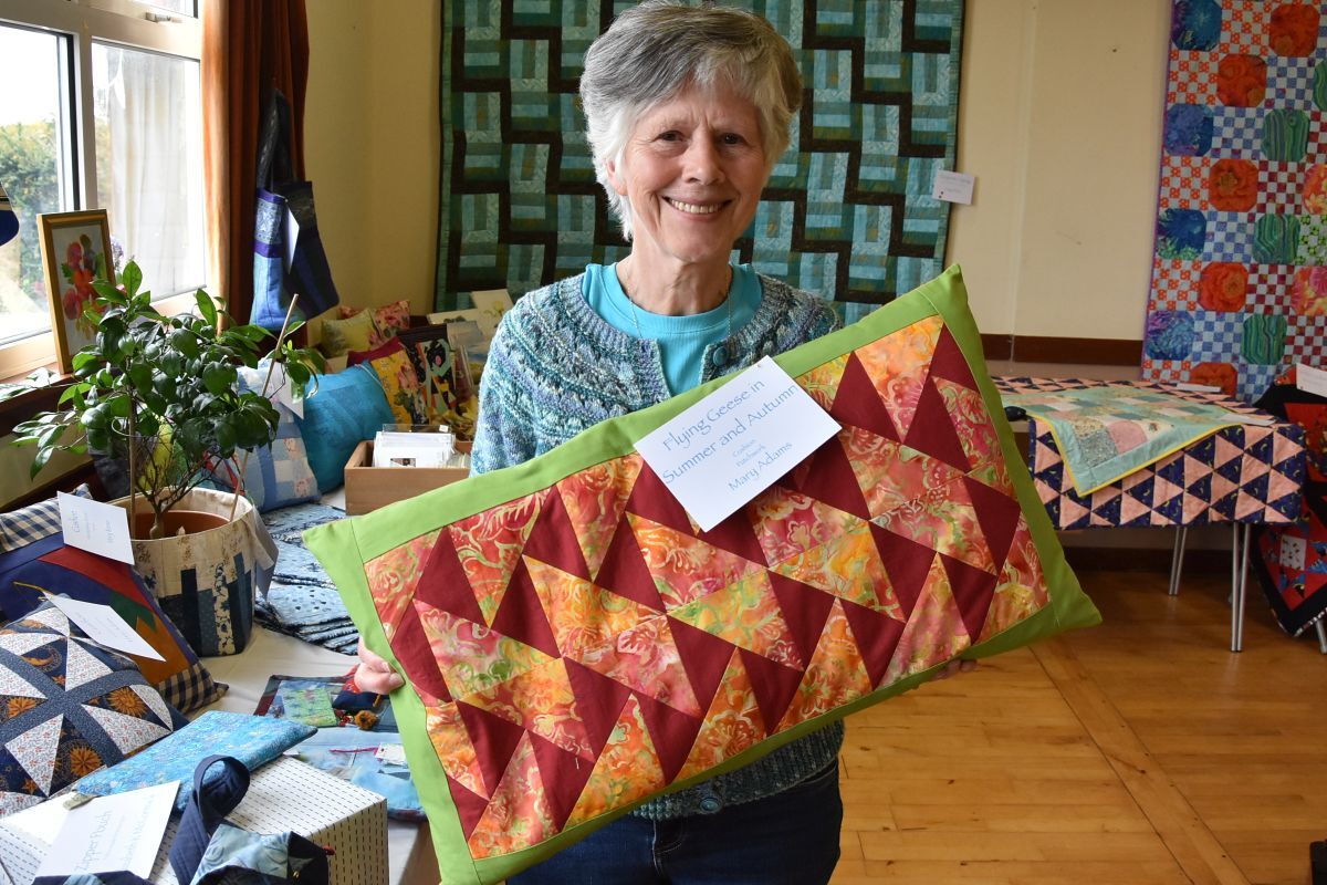 Mary Adams with her patchwork cushion. Mary had a number of items on display. 