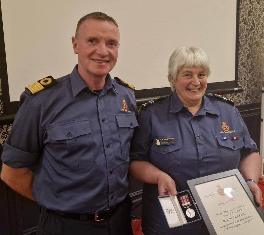Kenina Mackenzie (r) received her award from Pat O&rsquo;Callaghan. Photograph: HM Coastguard - Western Isles, Skye and Lochaber