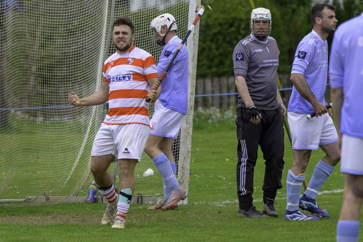 Lochaber's Ben Delaney celebrates his second goal of the day in the Artemis Macaulay Cup first round clash against Caberfeidh. Photograph: Phil Hughes.