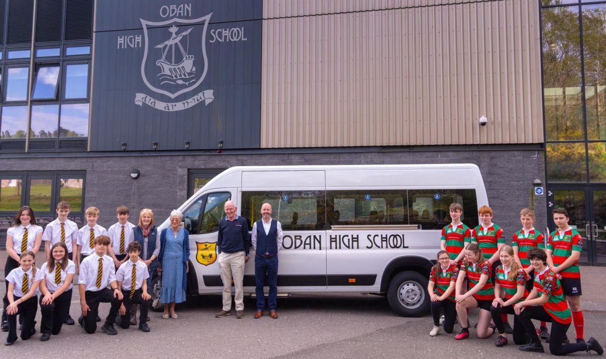 Oban High School pupils, head  teacher Peter Bain and representatives of the parent council and sponsors with the new 17-seater minibus