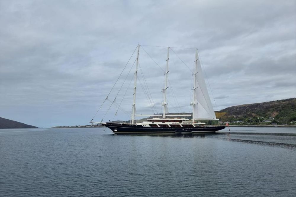 Who owns the mega yacht moored near Ullapool?