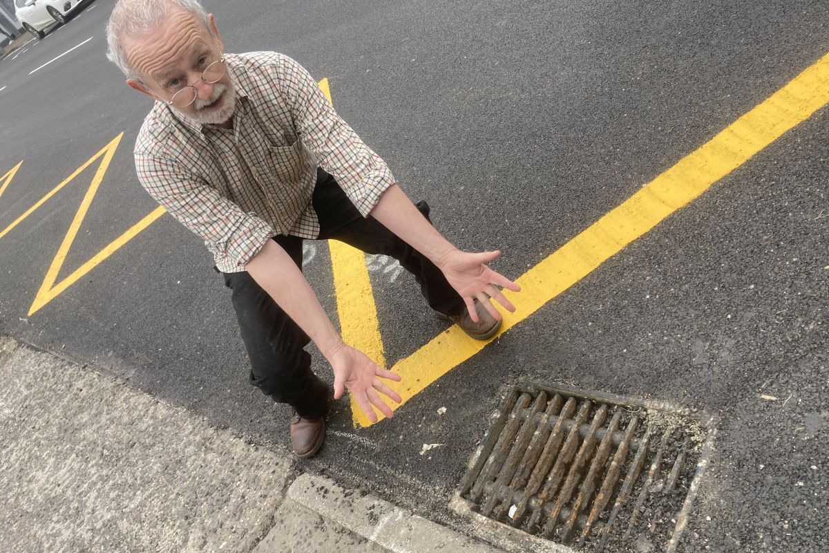 Resident’s shock as drains left filled with tar after resurfacing