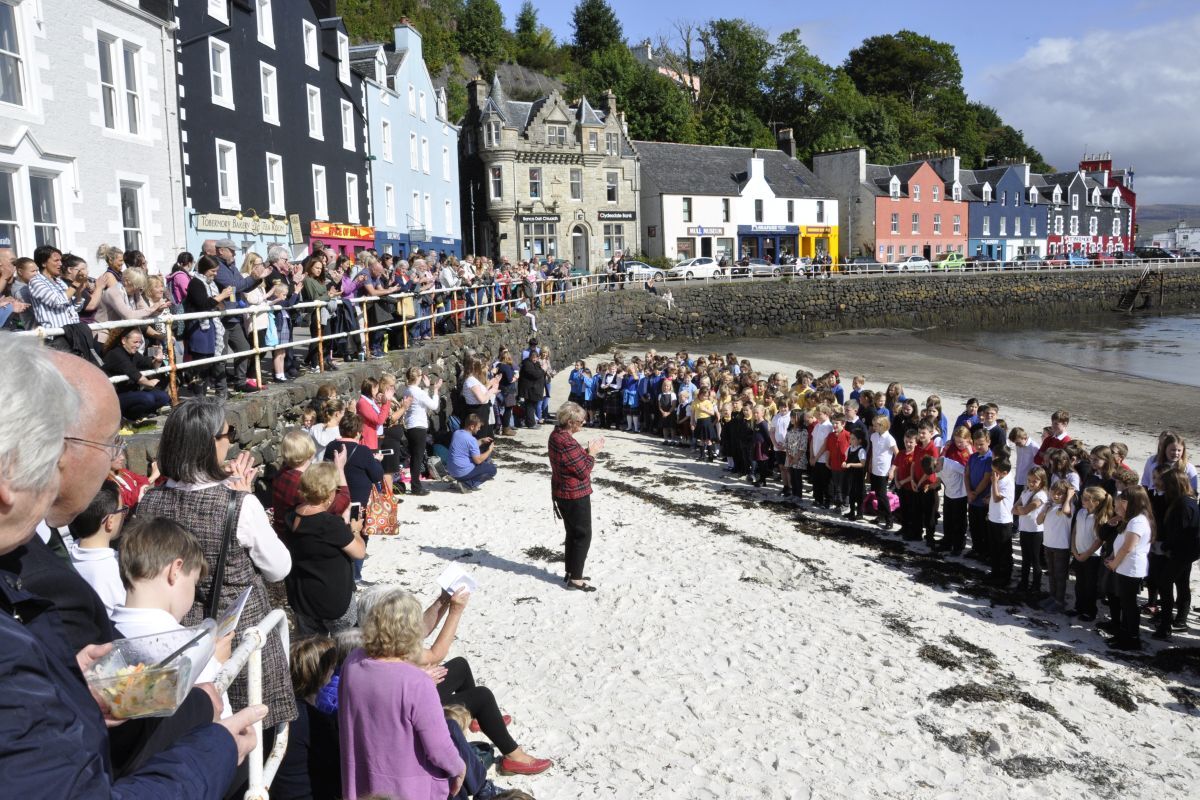 Children practice in front of a crowd in Tobermory bay at Mull Mòd 2018