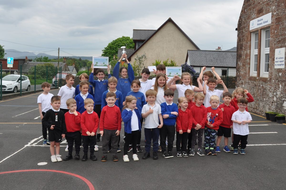 Pupils from Shiskine Primary School, winners of the average points category for Arran, hold their trophy with pride. 