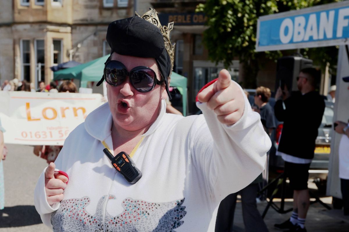 Charities Day is one of Oban's biggest fundraisers for good causes. Pictured is Elvis (aka Nicola Wilson of Oban Lions) cuts some moves in Station Square after leading last year's parade down George Street. Photograph: Kevin McGlynn