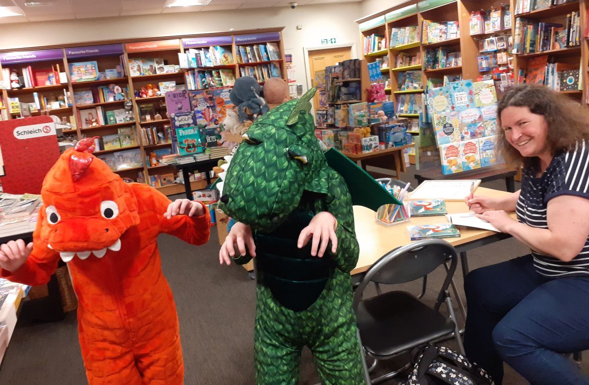 Louisa with two of her children, who dressed up in dragon costumes to celebrate the launch of their mum's debut children's book, Rory and the Snack Dragons, published by Kilchrenan based Little Door Books.