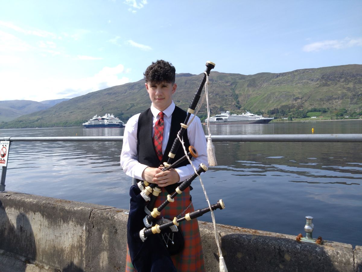 Piper Allan MacColl greeted passengers from the ships.