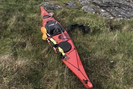 Red kayak on the shore of Colonsay