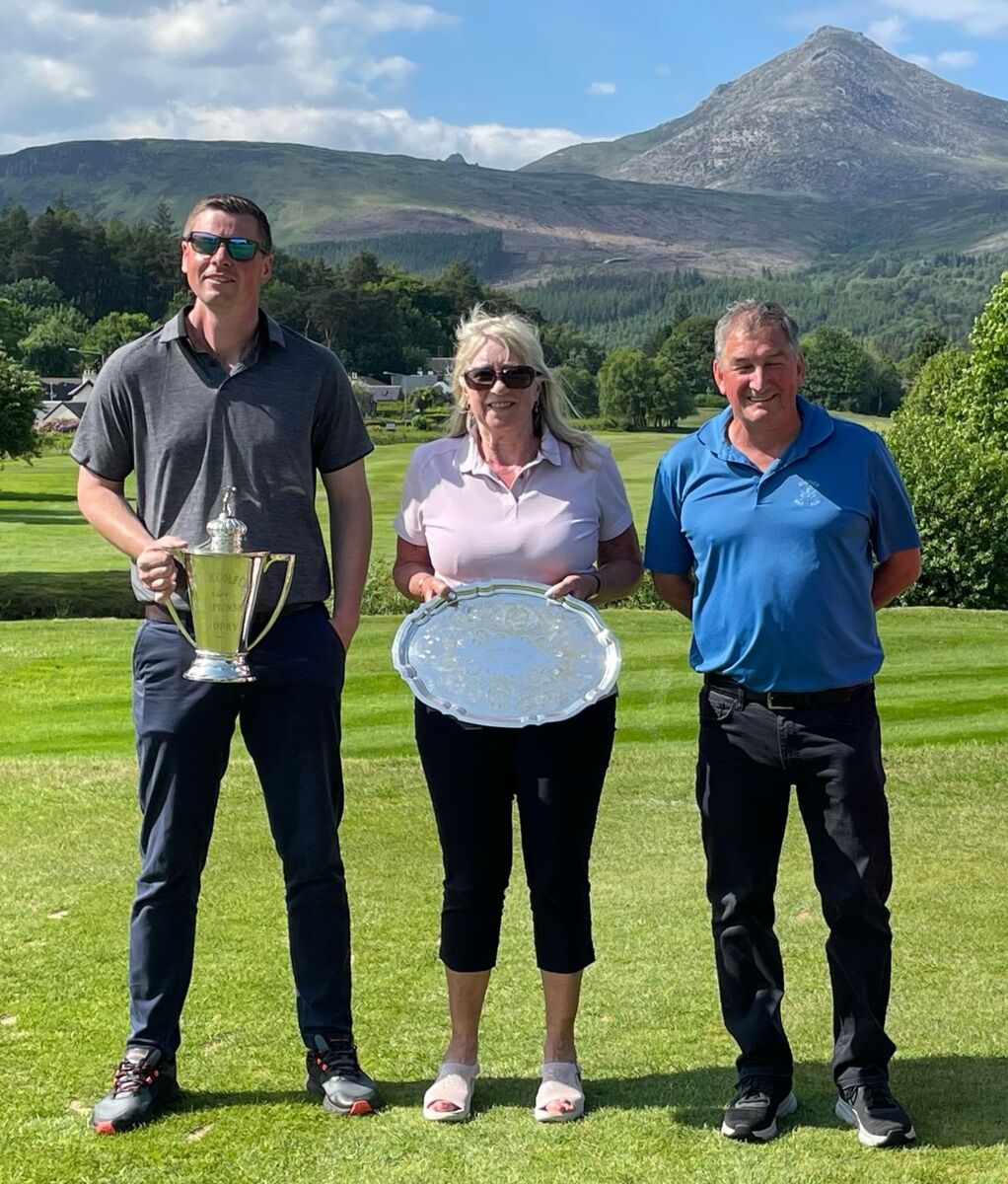 Brodick Golf Club captain Brian Smith with Ann May and Ewan McKinnon. 