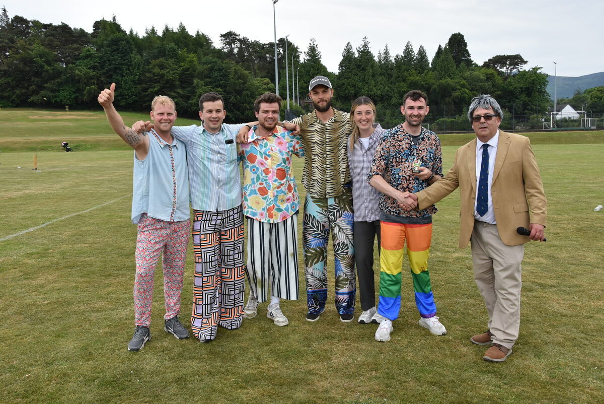 Last year’s winners, the Misfits, being awarded the smallest trophy that could be sourced online, by Eric Dunn of Sannox Cricket Club.