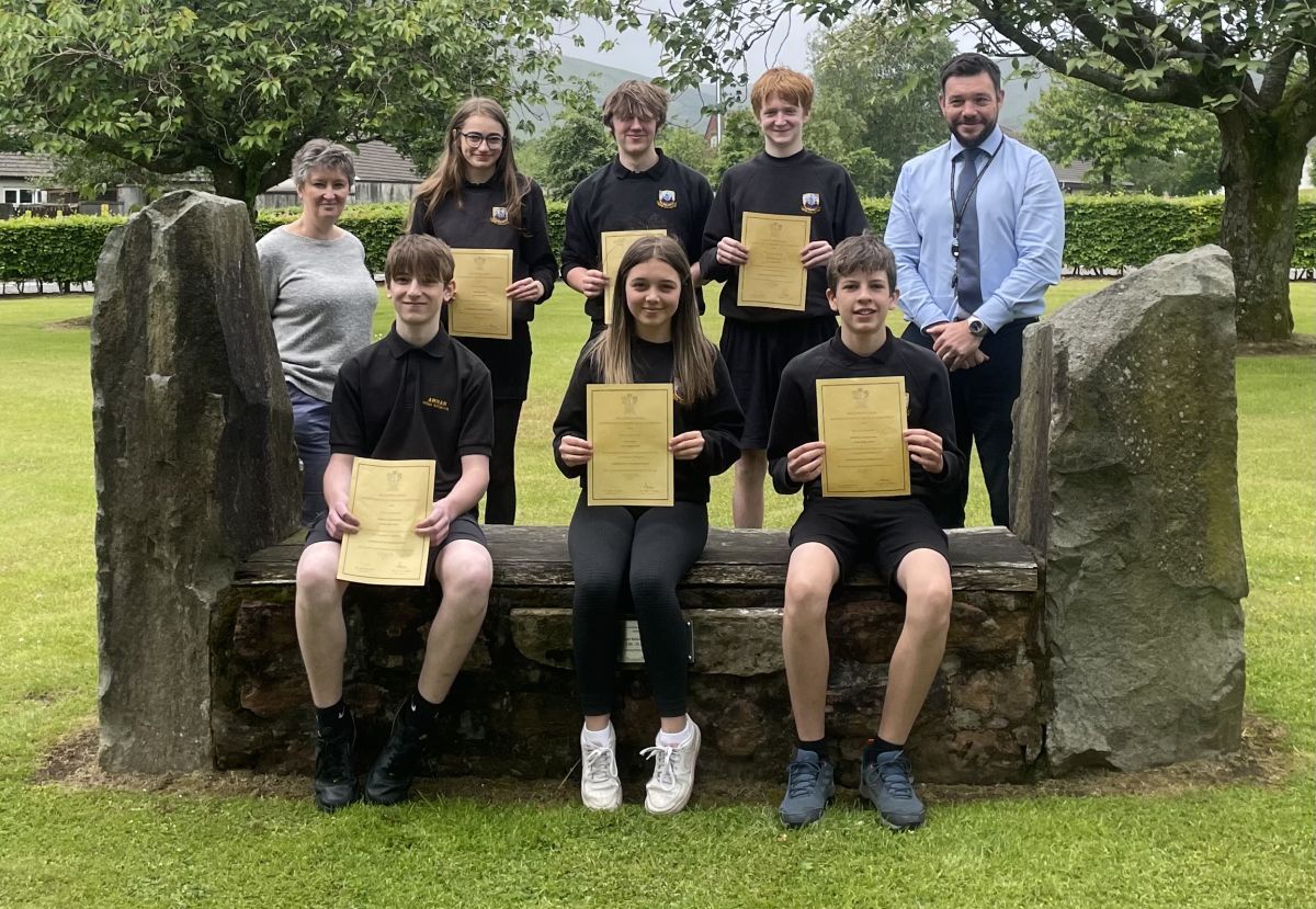 Depute head teacher Michelle Bunting and principal teacher of mathematics and numeracy Allan Wilson with the pupils who helped the school finish second in the Scottish Schools' Mathematician of the Year competition. Photograph: Arran High School.