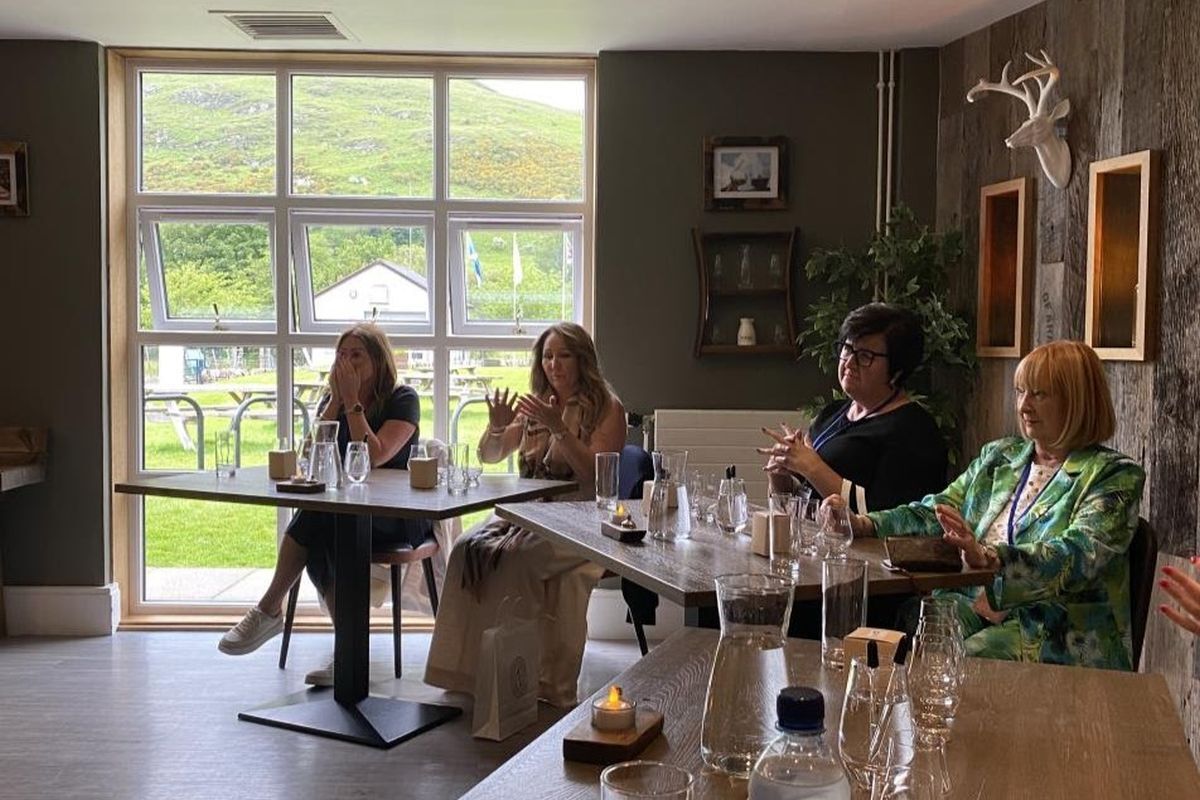 The visitors at Lochranza Distillery, learning about the art of whisky making. Photograph: Ayrshire Chamber of Commerce.