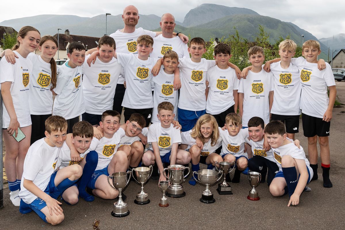 The Caol Primary School shinty team and their coaches at the surprise celebration. Photograph: Iain. Ferguson, alba.photos.