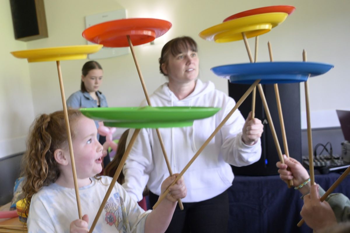 Spinning plates with Maddie the Children’s Entertainer was a popular indoor activity. Photograph: Iain Ferguson, alba.photos.