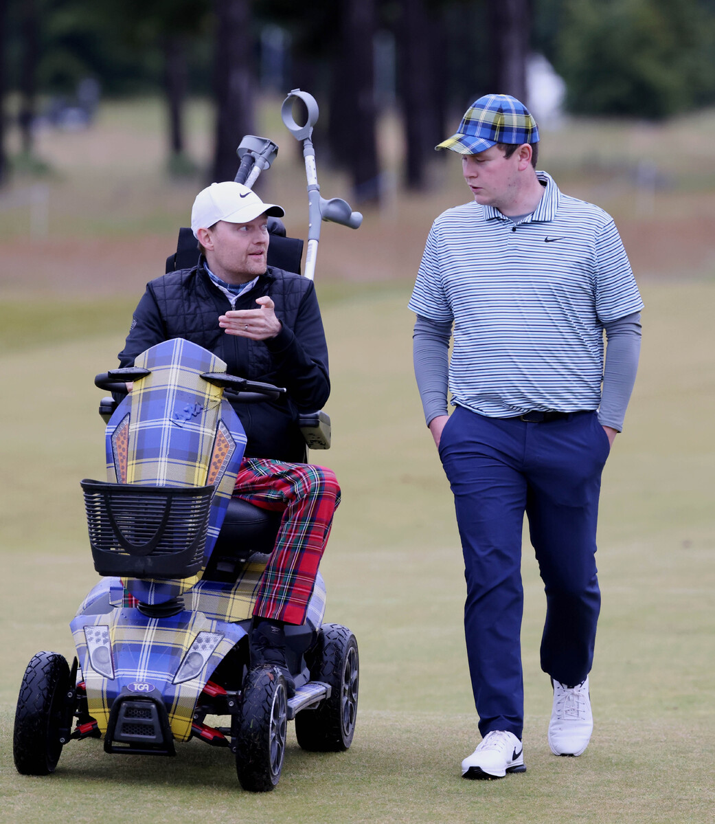 Bob MacIntyre walks with Scott Stewart ambassador for My Names Doddie foundation in the pro-am. Scott was a scratch golfer before being struck down with motor neuron disease