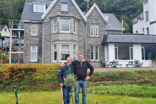 Leon Cabral, owner of the Lodge on the Loch, with his father.