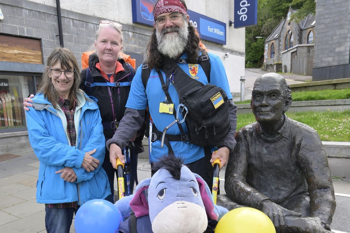 John Bryden, his wife Jan (left) and Charity Administrator Sally Gardner set off from the Fort William start point to tackle the West Highland Way raising money for a trip to Ukraine. Photograph:Iain Ferguson, alba.photos.