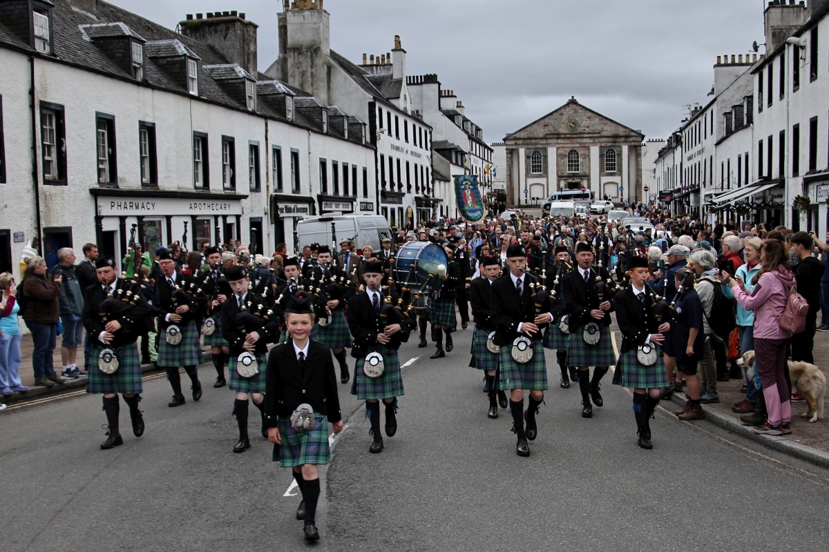 Amy Anderson leads Mid Argyll Pipe Band down the main street in Inveraray as they parade to the games at the Winterton in the grounds of Inveraray Castle. Photograph: Kevin McGlynn