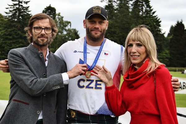 Vlad Tulacek Cze, centre, winner of the world caber tossing championship Inveraray games with Kris and Niki Clark of the George Hotel Inveraray. Photograph: Kevin McGlynn