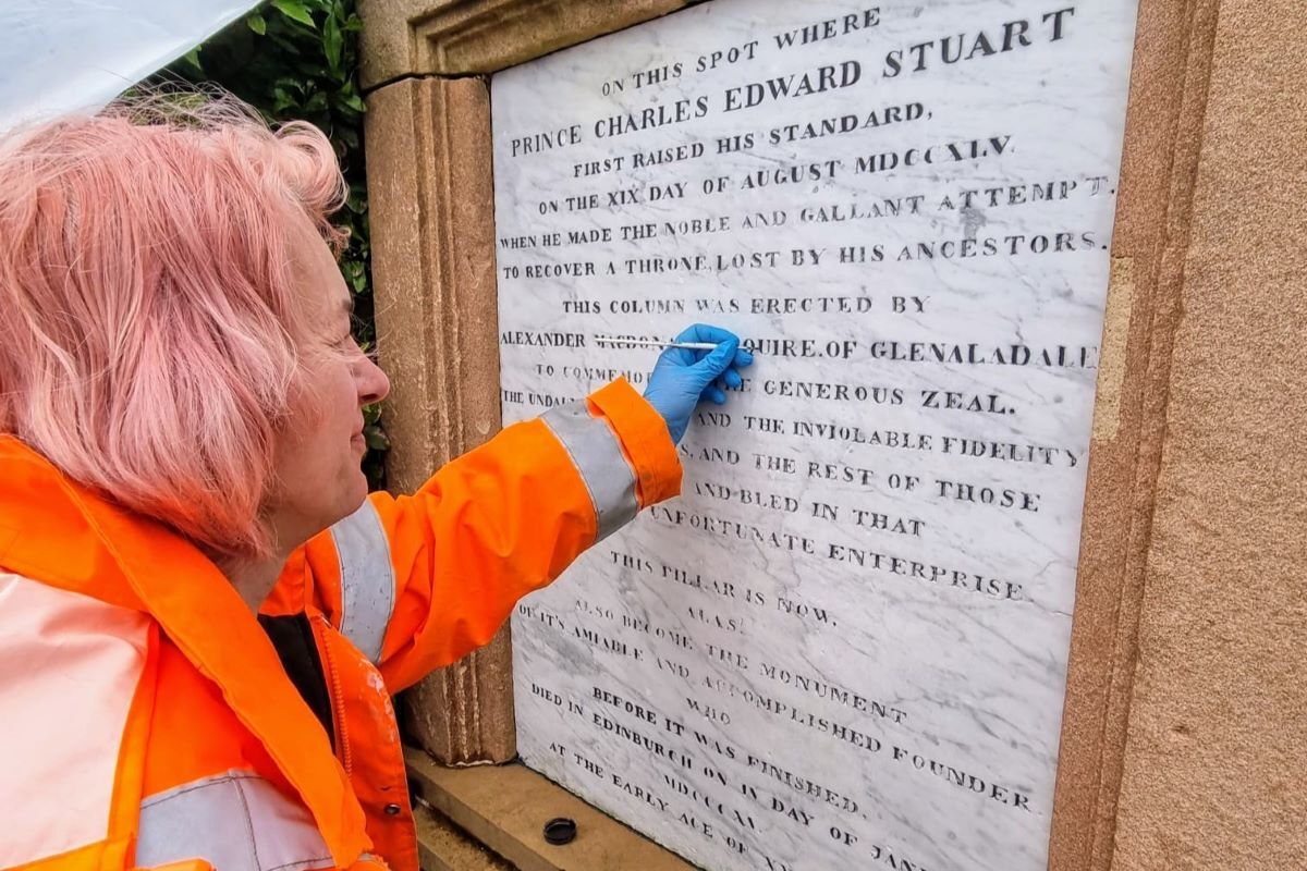 Csilla Karsay from Edinburgh-based Graciela Ainsworth Sculpture Conservation keeps a steady hand as she repaints the lettering on the 200-year-old plaque.