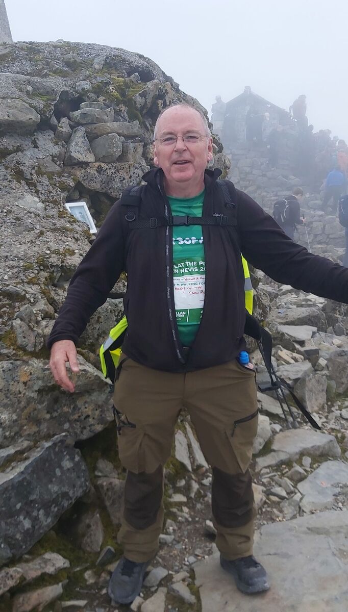 Willie Munro at the peak of Ben Nevis in aid of Macmillan Cancer Support.