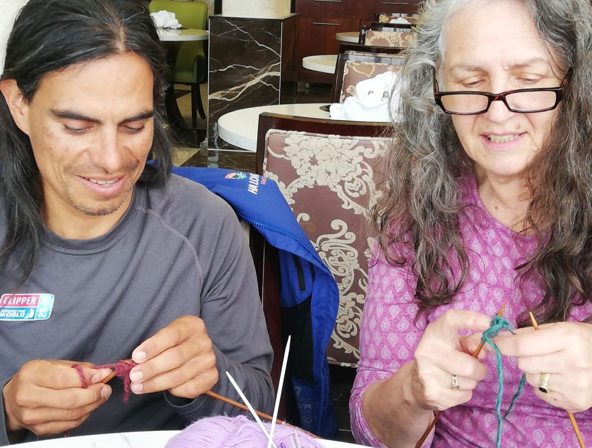 Clipper crewman Nicolas and his 'teacher' Joy Cameron enjoy a knit and knatter.