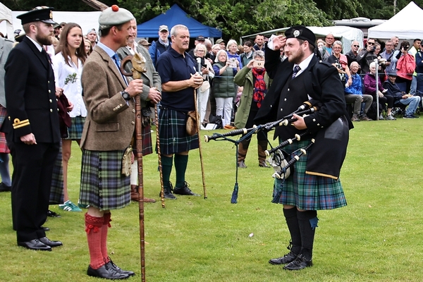 His Grace the Duke of Argyll Torquhil Campbell takes the salute from Nic MacLean, pipe major of Mid Argyll Pipe Band. Photograph: Kevin McGlynn