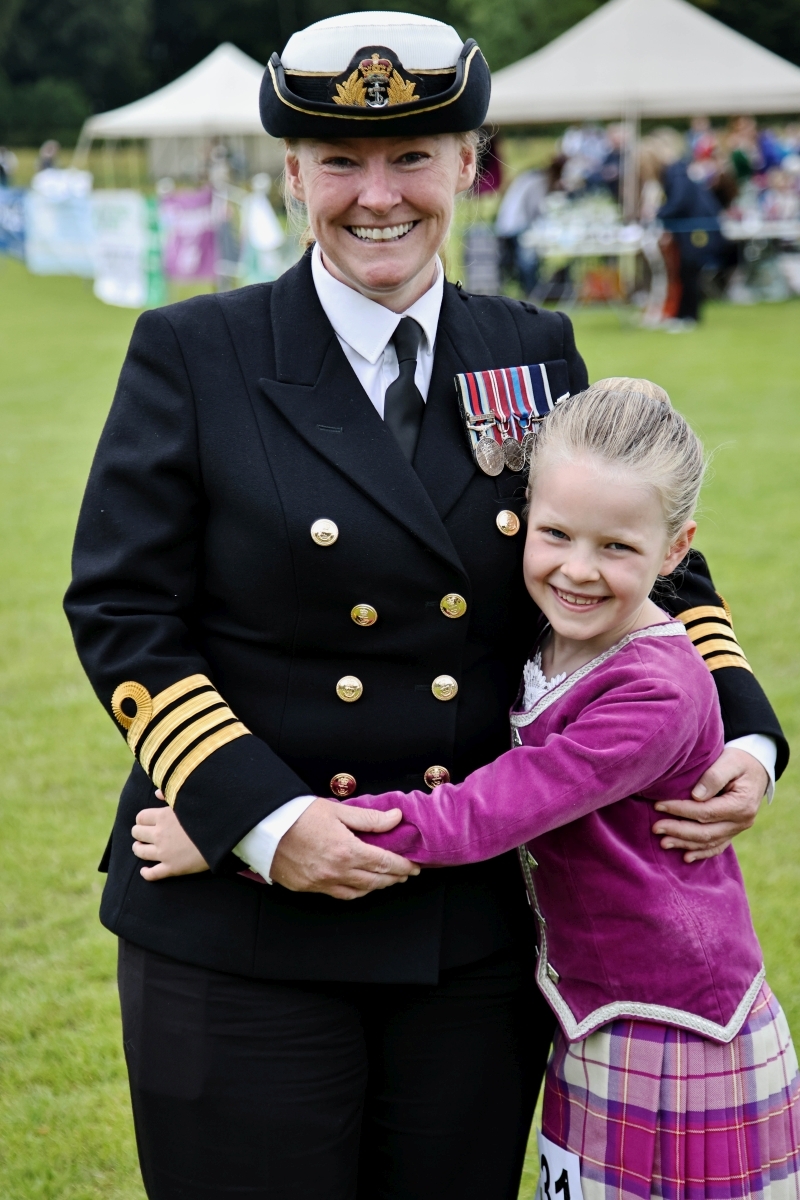 Captain Elaine Boyd, guest of honour, is delighted to get a hug from her niece Alice MacBeath, 7, who was dancing at Inveraray games. Photograph: Kevin McGlynn