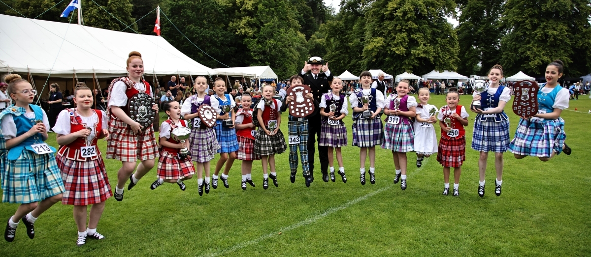 Dancing trophy winners jumping for joy with Captain Elaine Boyd. Photograph: Kevin McGlynn