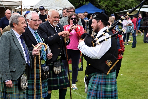 Jim MacMillan retiring treasures after 34 years given the privilege of taking the salute to allow Mid Argyll Pipe Band to march off. Photograph: Kevin McGlynn