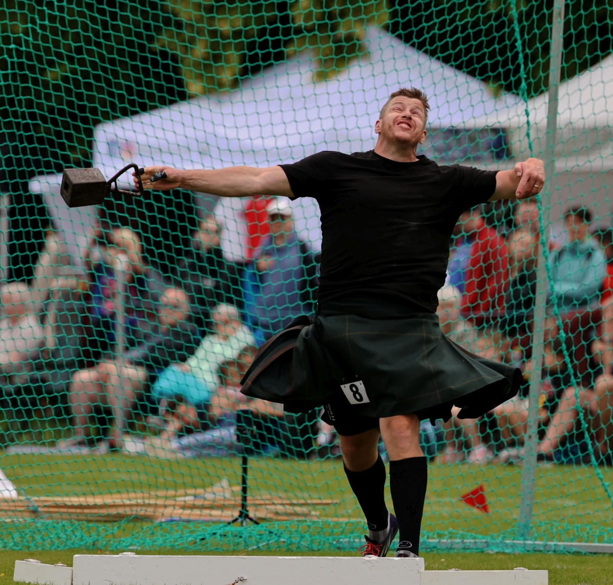 Lorne Colthart, formerly of Appin now living in Canada, throwing the 56lb weight for distance. Photograph: Kevin McGlynn