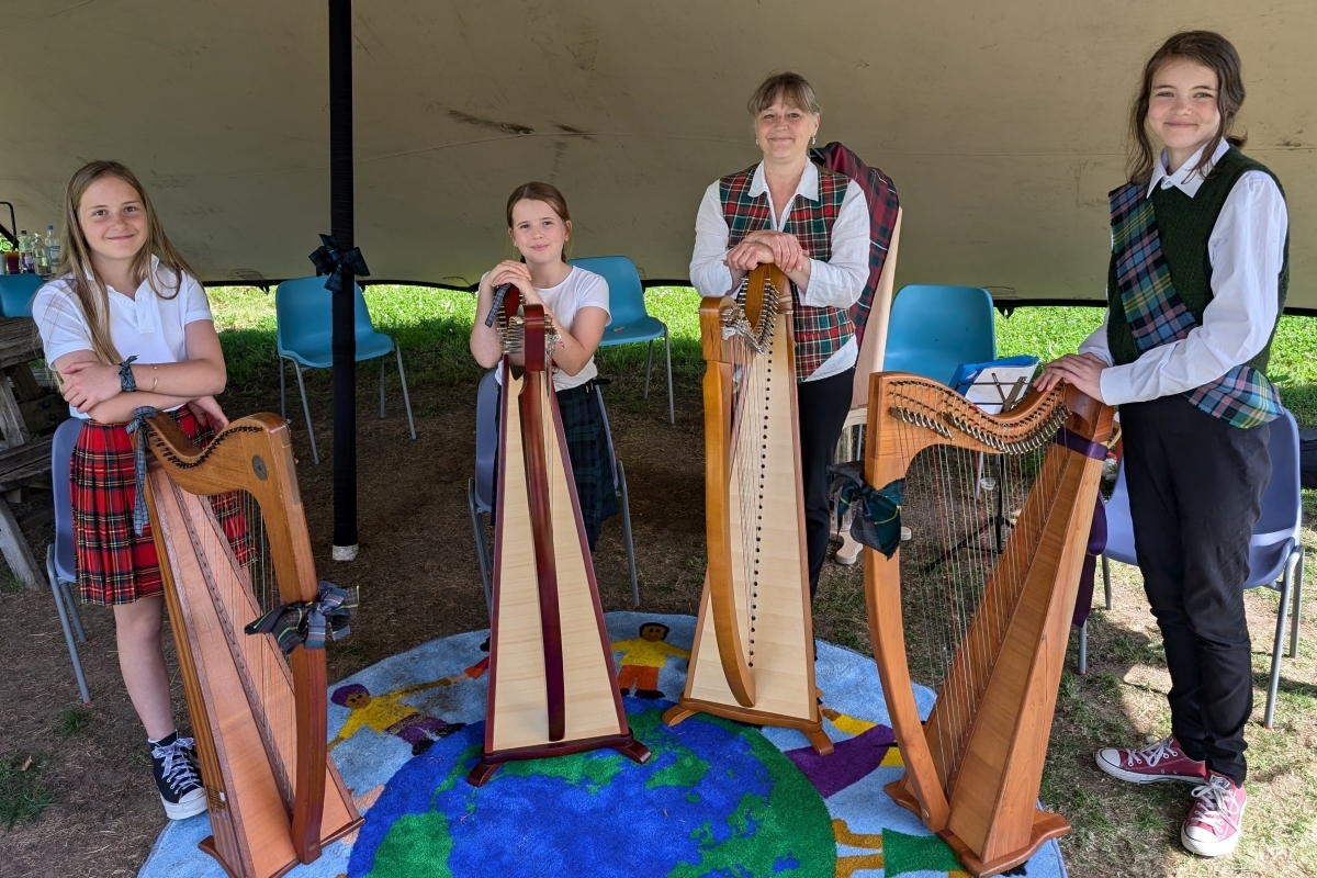 Tutor Alicia Chapple with pupils Lily, Lena and Alannah at the Fèis an Tairbeirt harpathon in Kilmartin. Photograph: Alistair Watson
