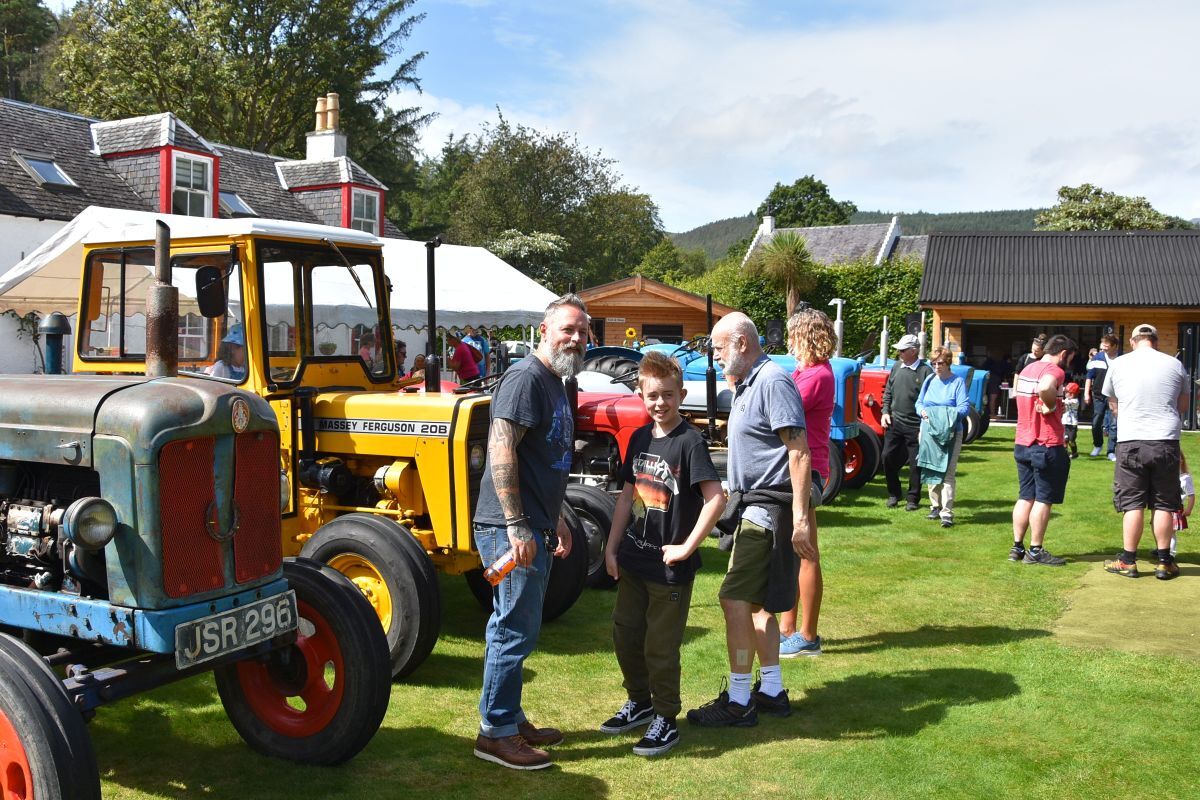 Visitors browse the tractors on show.